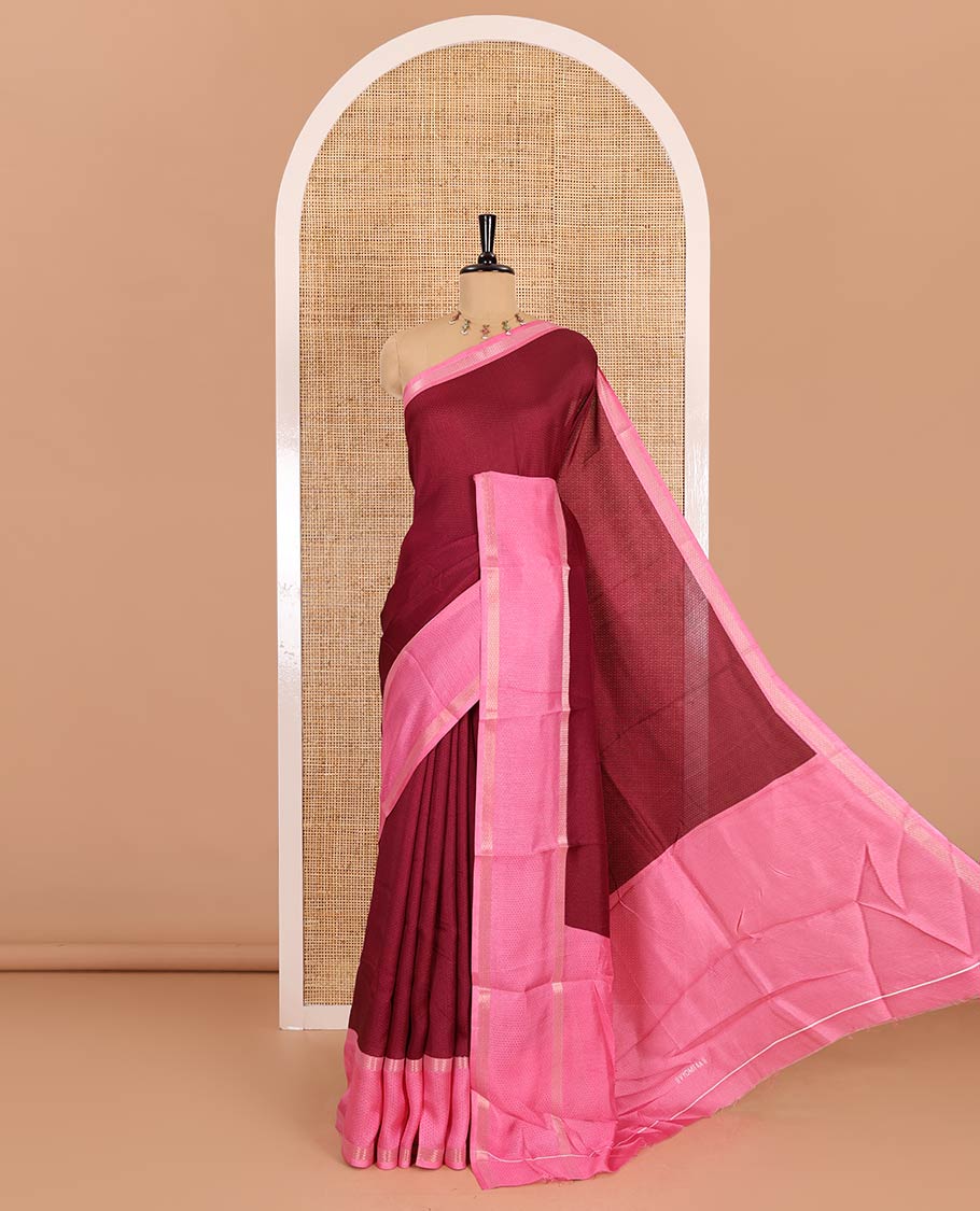 Wine embossed moss chiffon saree, contrast traditional rettai pettu border, embossed pallu, and a contrast embossed blouse