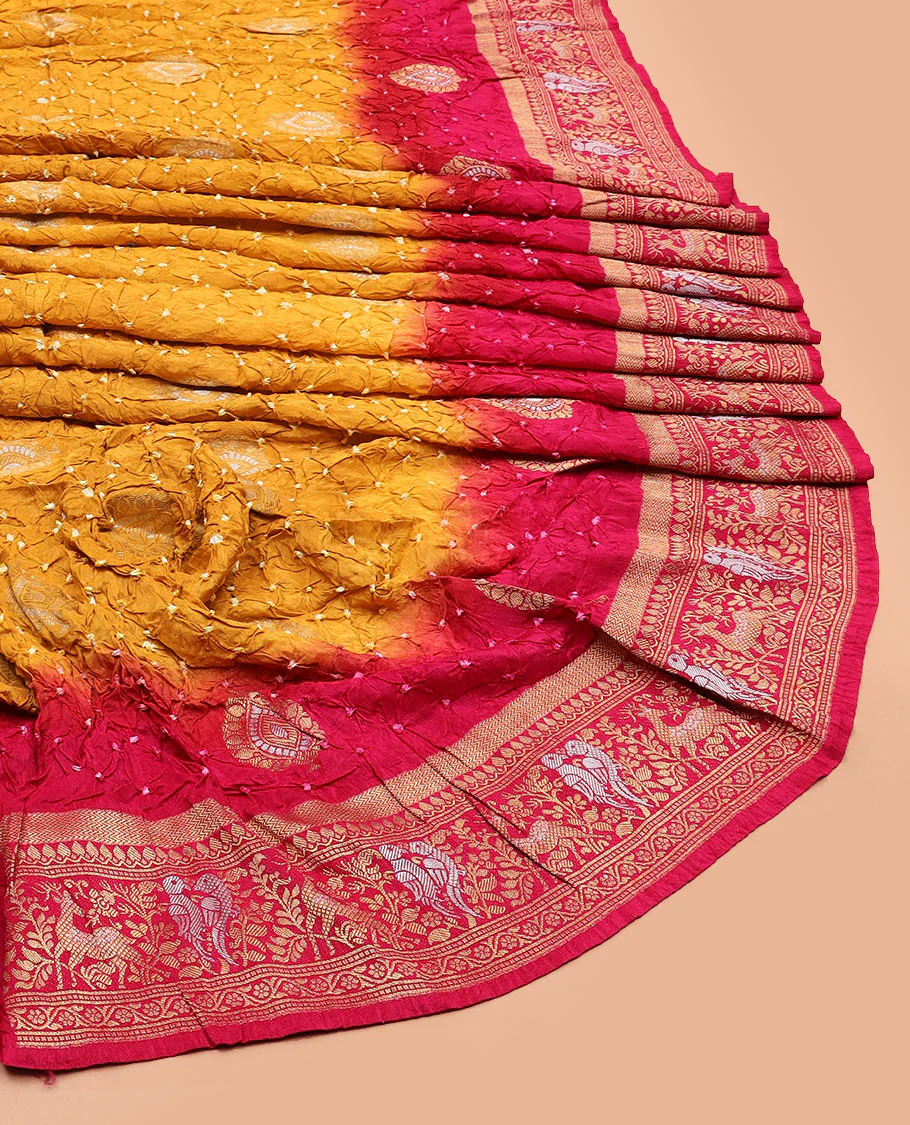 Yellow bandhani dots and zari buttas bandhani silk saree, contrast flora-fauna motifs woven border, and patola elephant enclosed ogee patterns - Image 2