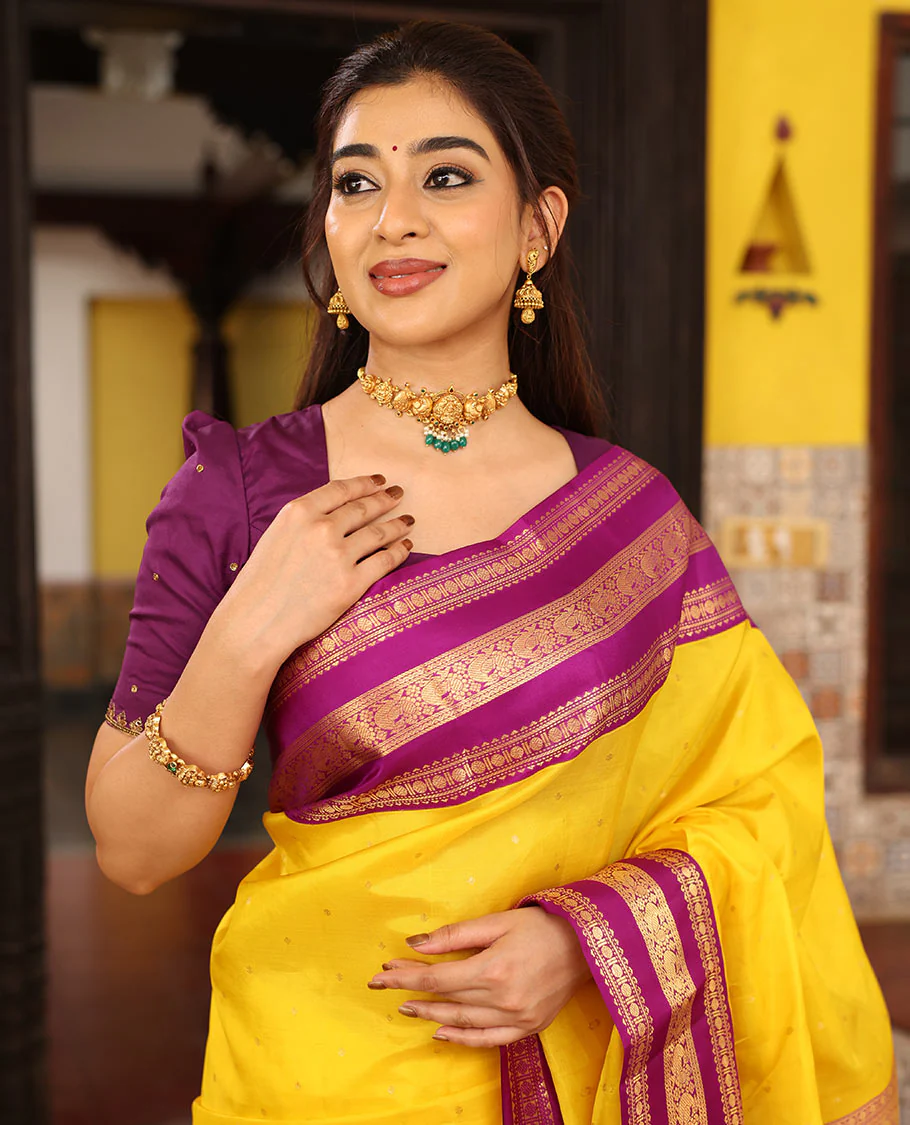 Yellow Vasundhara Silk Saree Finely Woven with Zari Buttas, Complemented with Varisai Pettu Border Featuring Rekku, Muthu, Banaras, Rudraksham, and Mayil Designs, Majestically Zari-Woven Pallu, and a Contrast Blouse - Image 2